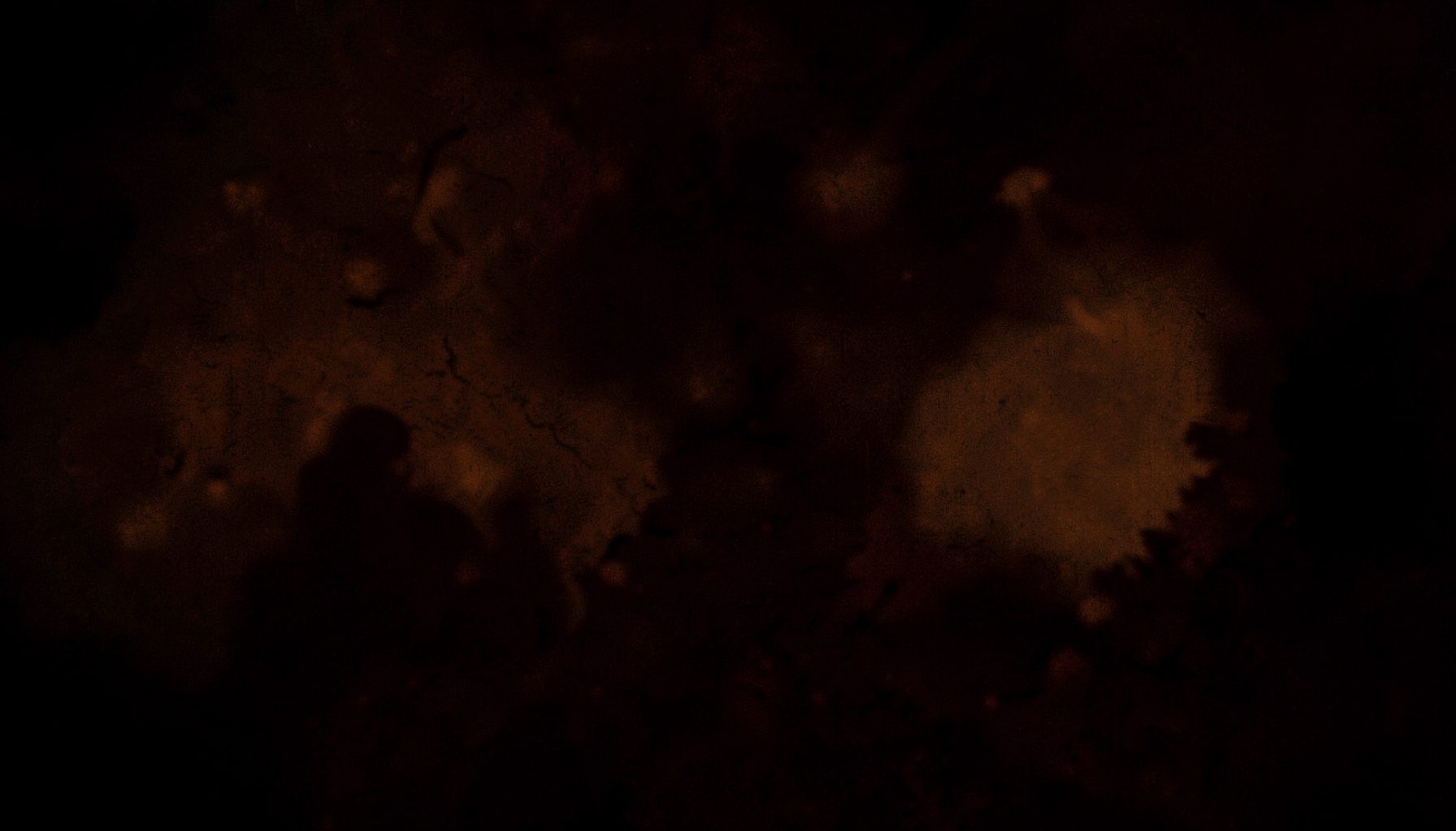 Dark atmospheric scene with warm amber and deep shadow tones, dramatic mood
