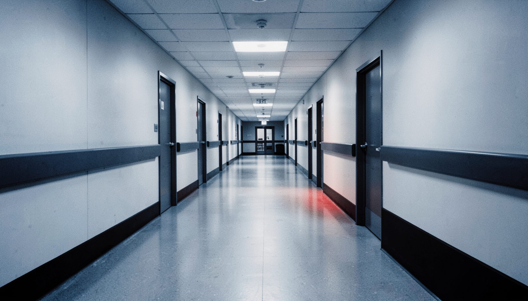 Hospital corridor with cool blue and white tones, professional mood